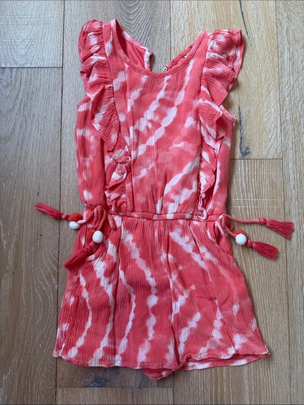 Justice Coral and White Tie-Dye Romper with Ruffle Shoulders